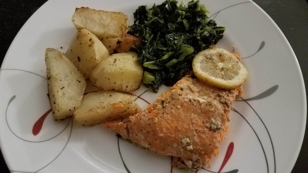 photo of salmon plated with potaotoes and greens