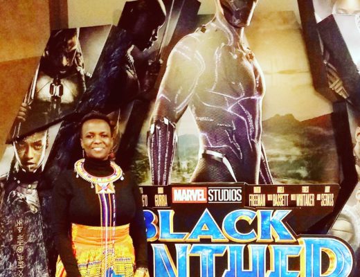 Posing in front of Black Panther movie display
